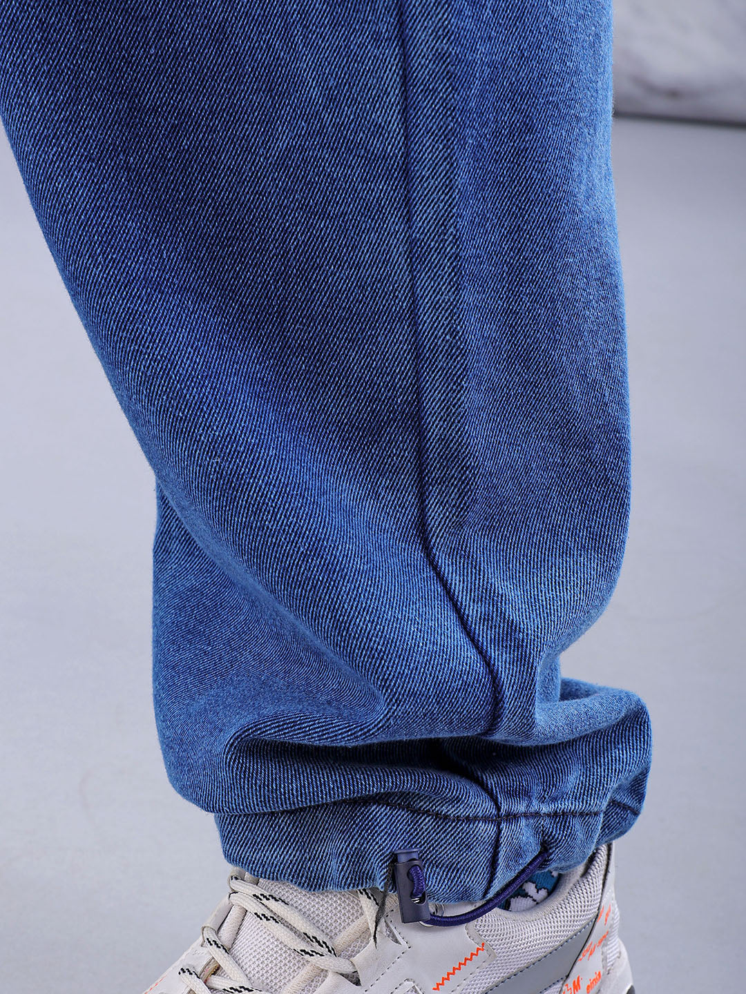 Shop Men's Solid Relaxed Fit Denim Joggers Online.