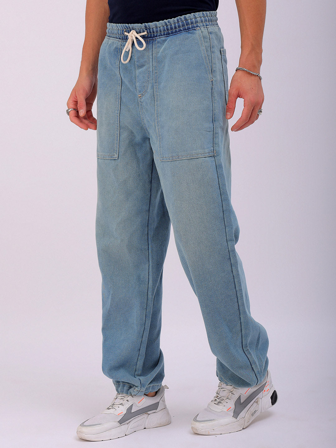 Shop Men's Solid Relaxed Fit Denim Joggers Online.