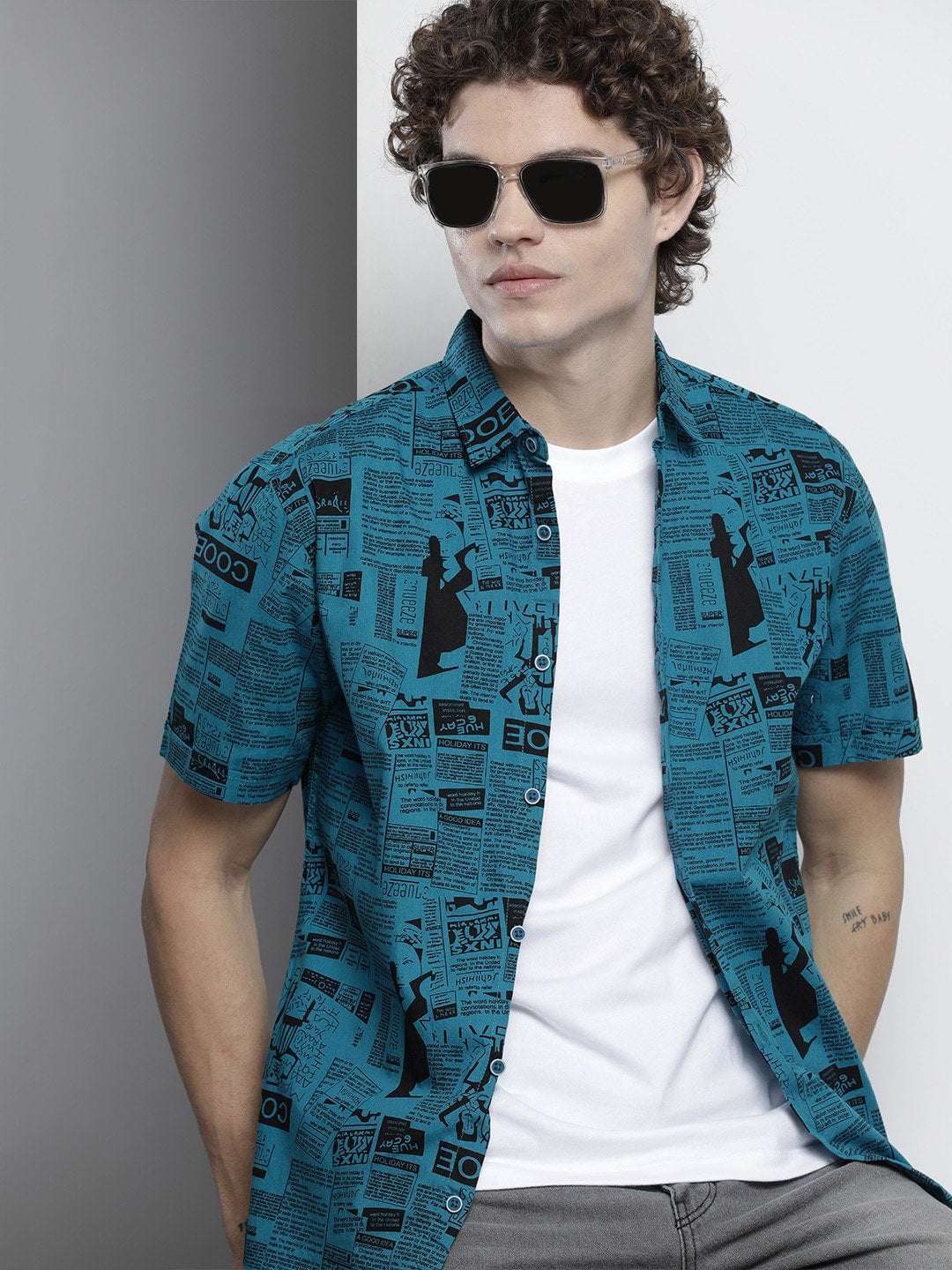 Shop The Indian Garage Co Men Teal Blur & Black Comfort Newspaper Printed Cotton Shirt Online.