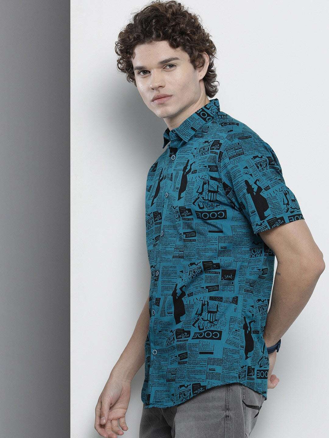 Shop The Indian Garage Co Men Teal Blur & Black Comfort Newspaper Printed Cotton Shirt Online.