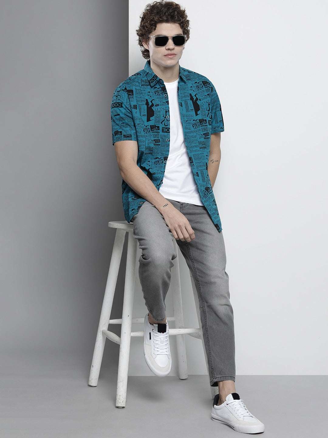 Shop The Indian Garage Co Men Teal Blur & Black Comfort Newspaper Printed Cotton Shirt Online.