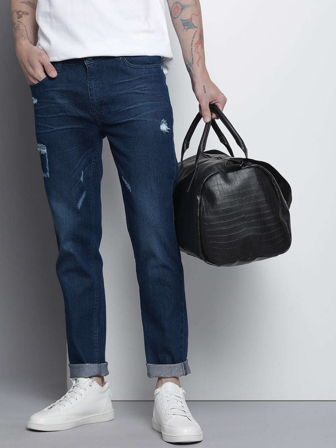 Shop Men Whisker Distressed Jeans Online.