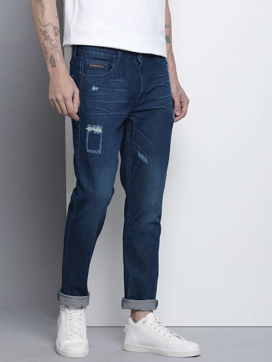 Shop Men Whisker Distressed Jeans Online.