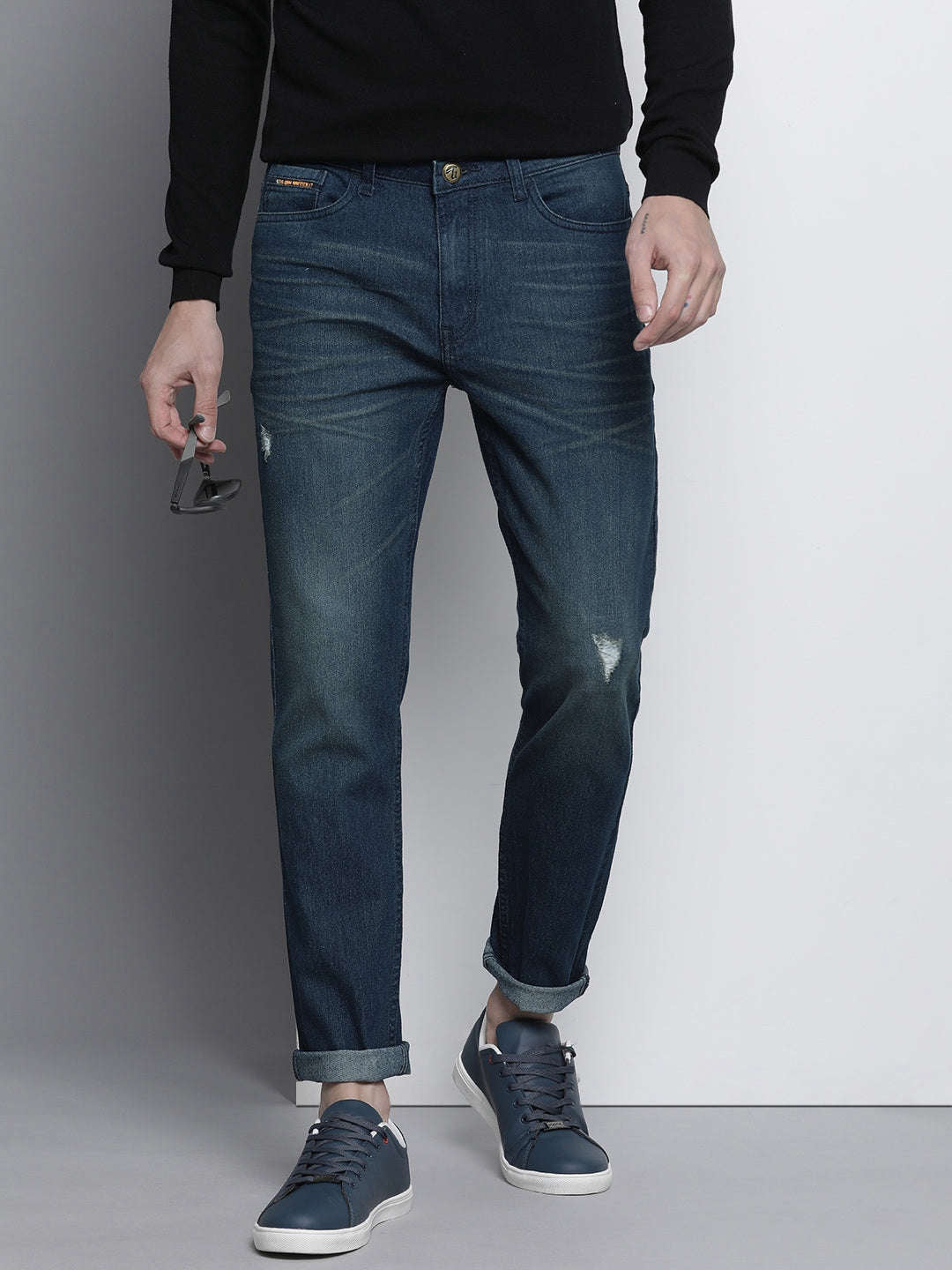 Shop Men Whisker Distressed Jeans Online.