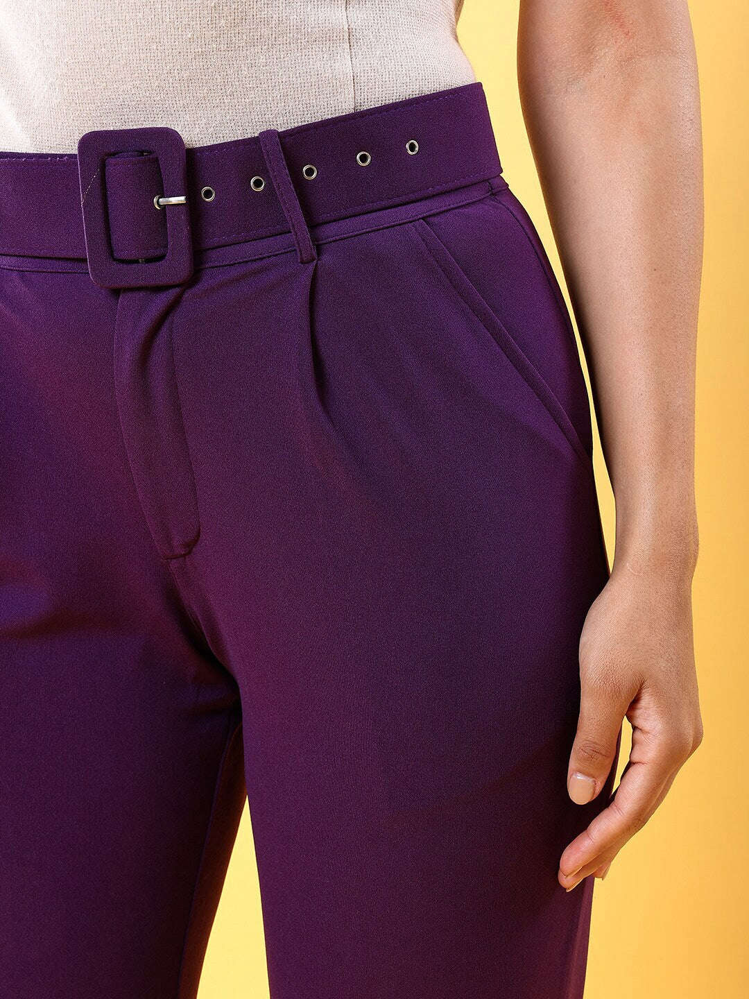 Shop Women Tapered Pleated Pant With Belt Online.