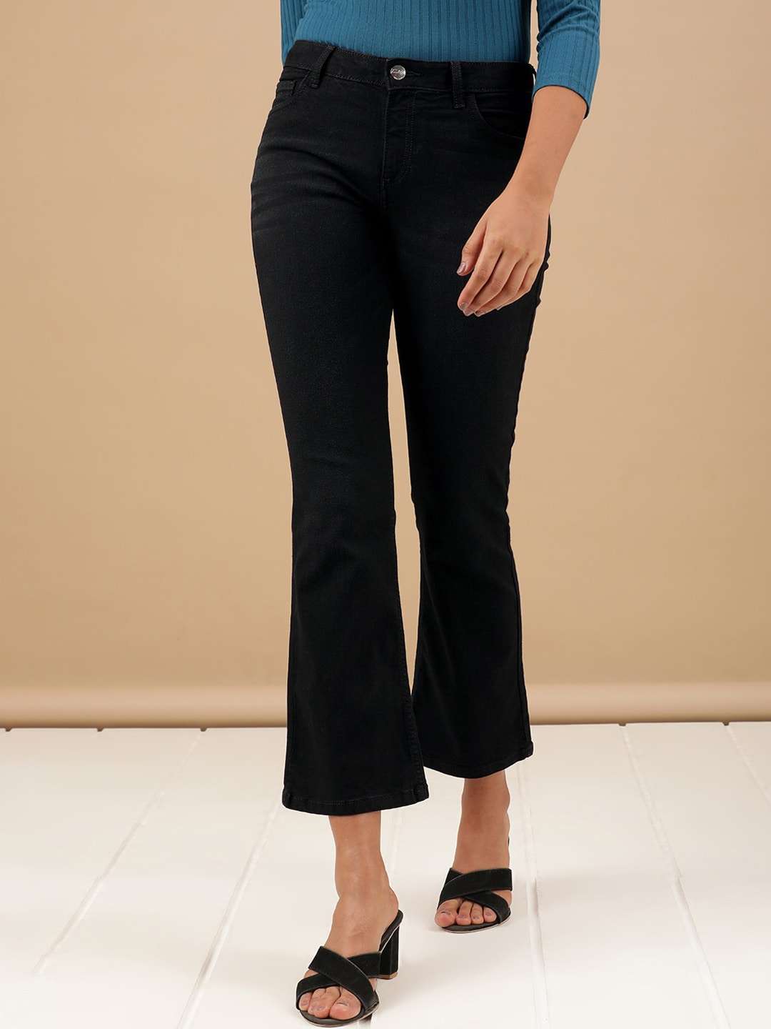 Shop Women Solid Black Bootcut Denim Jeans Online.