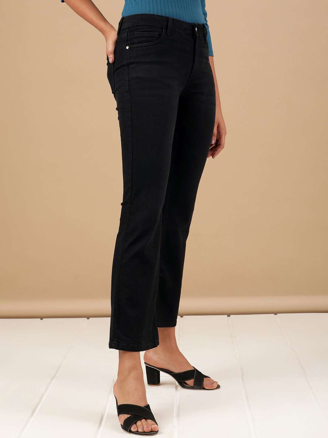 Shop Women Solid Black Bootcut Denim Jeans Online.