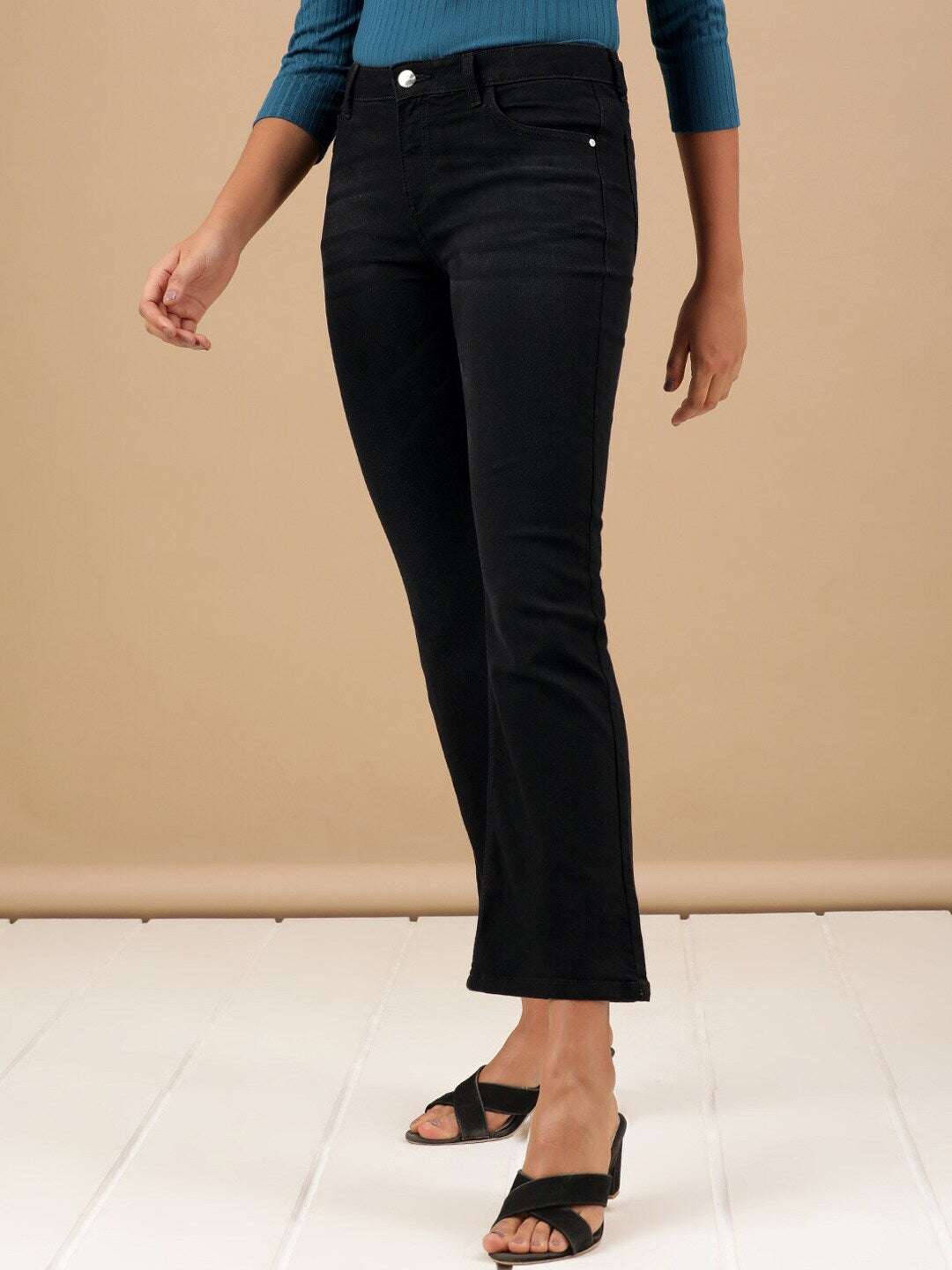 Shop Women Solid Black Bootcut Denim Jeans Online.