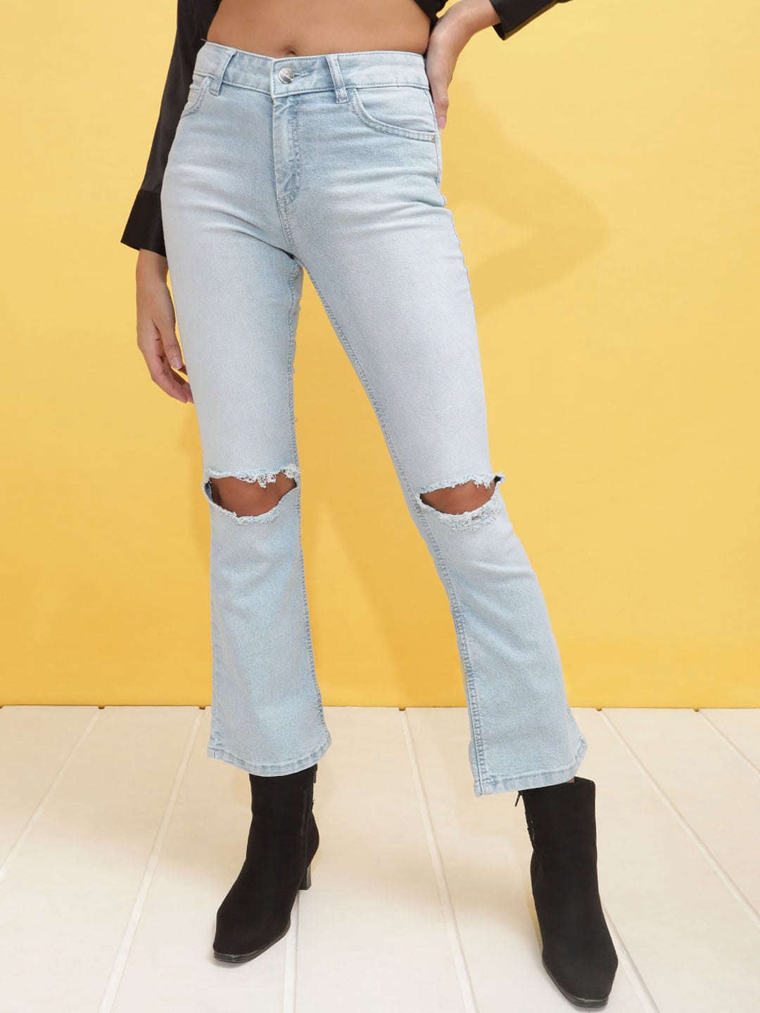 Shop Women Mid Wash Bootcut Denim Jeans Online.