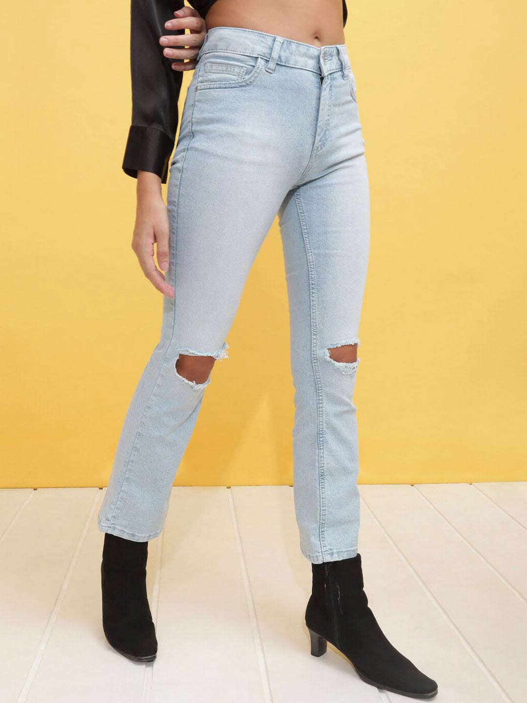 Shop Women Mid Wash Bootcut Denim Jeans Online.