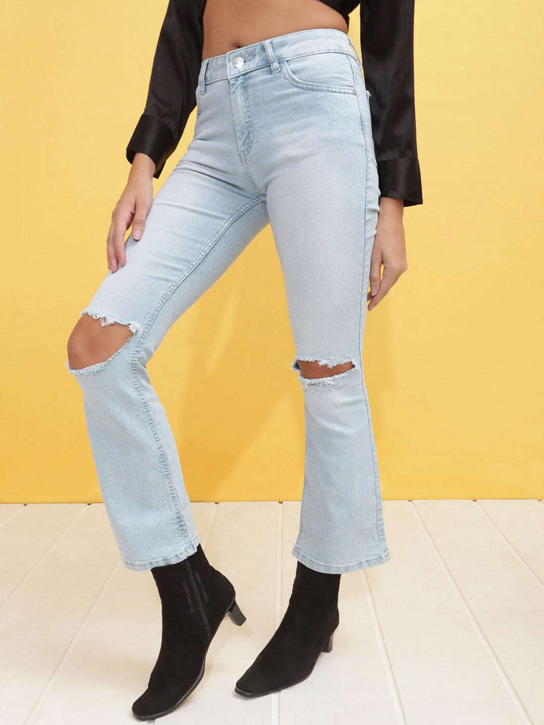 Shop Women Mid Wash Bootcut Denim Jeans Online.