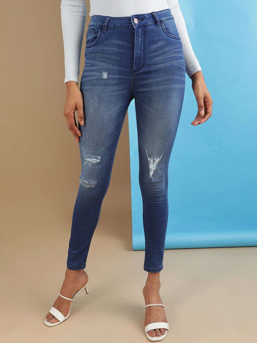 Shop Women Distressed Skinny Fit Denim Jeans Online.