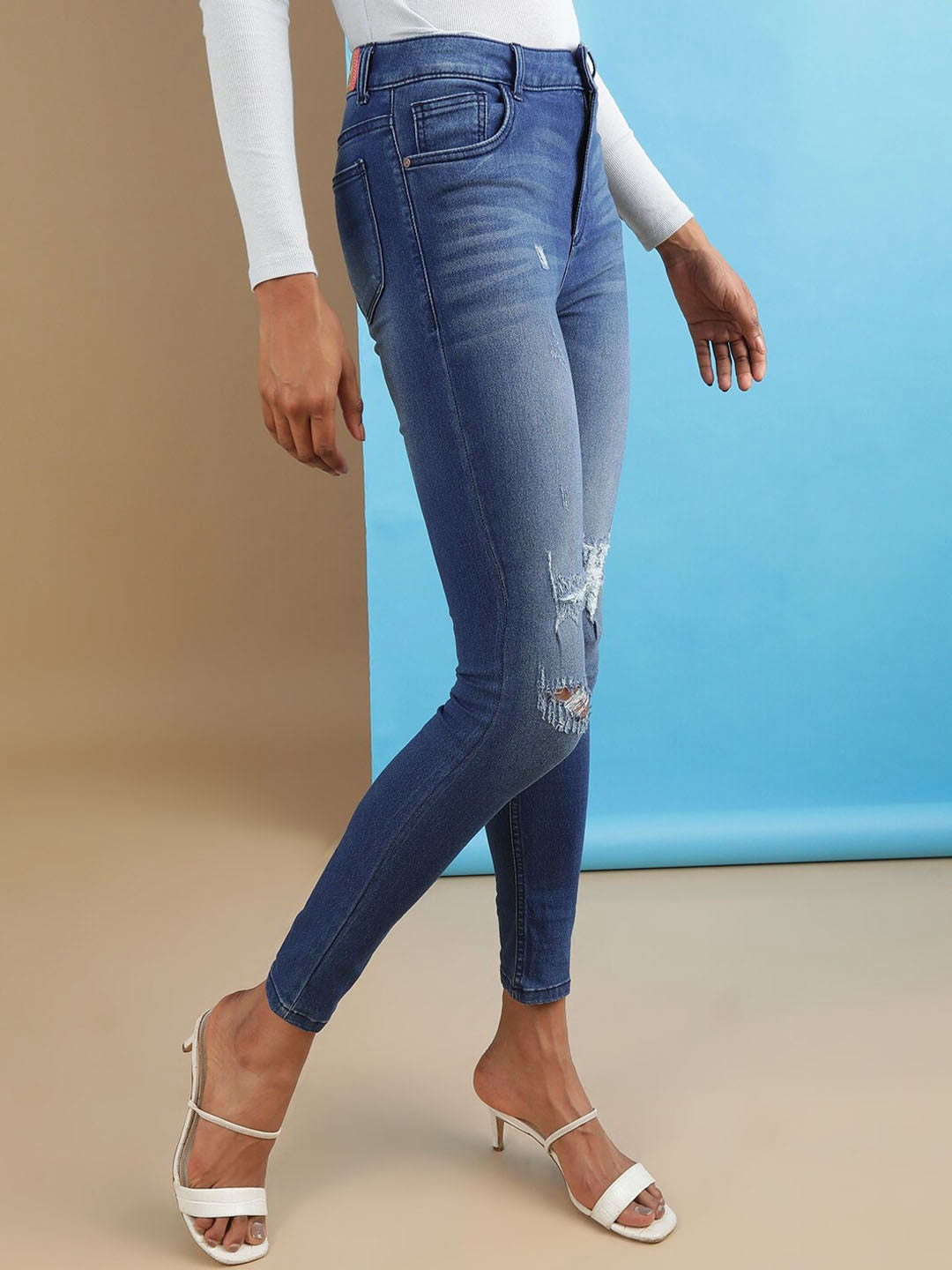 Shop Women Distressed Skinny Fit Denim Jeans Online.