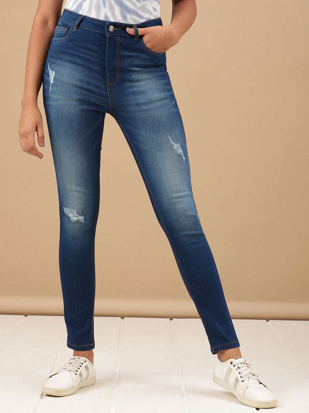 Shop Women Distressed Skinny Fit Denim Jeans Online.