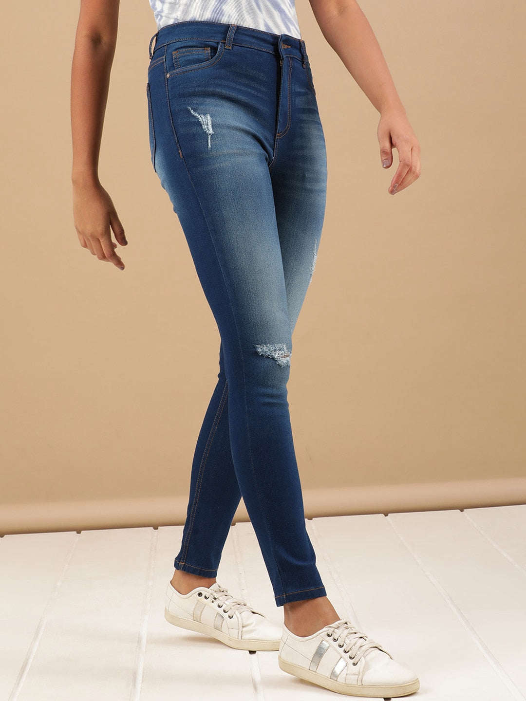 Shop Women Distressed Skinny Fit Denim Jeans Online.