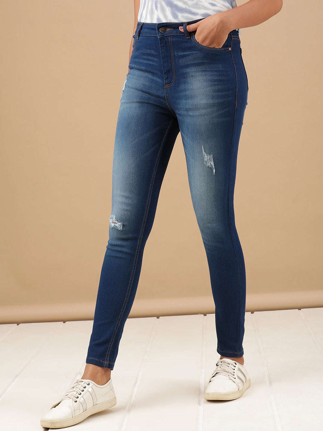 Shop Women Distressed Skinny Fit Denim Jeans Online.