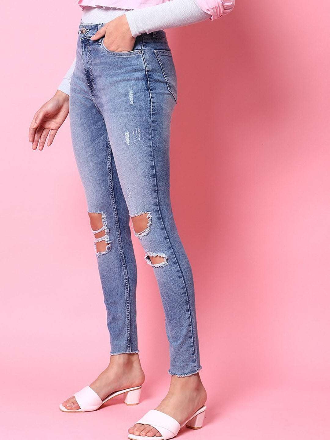 Shop Women Distressed Tinted Slim Fit Jeans Online.