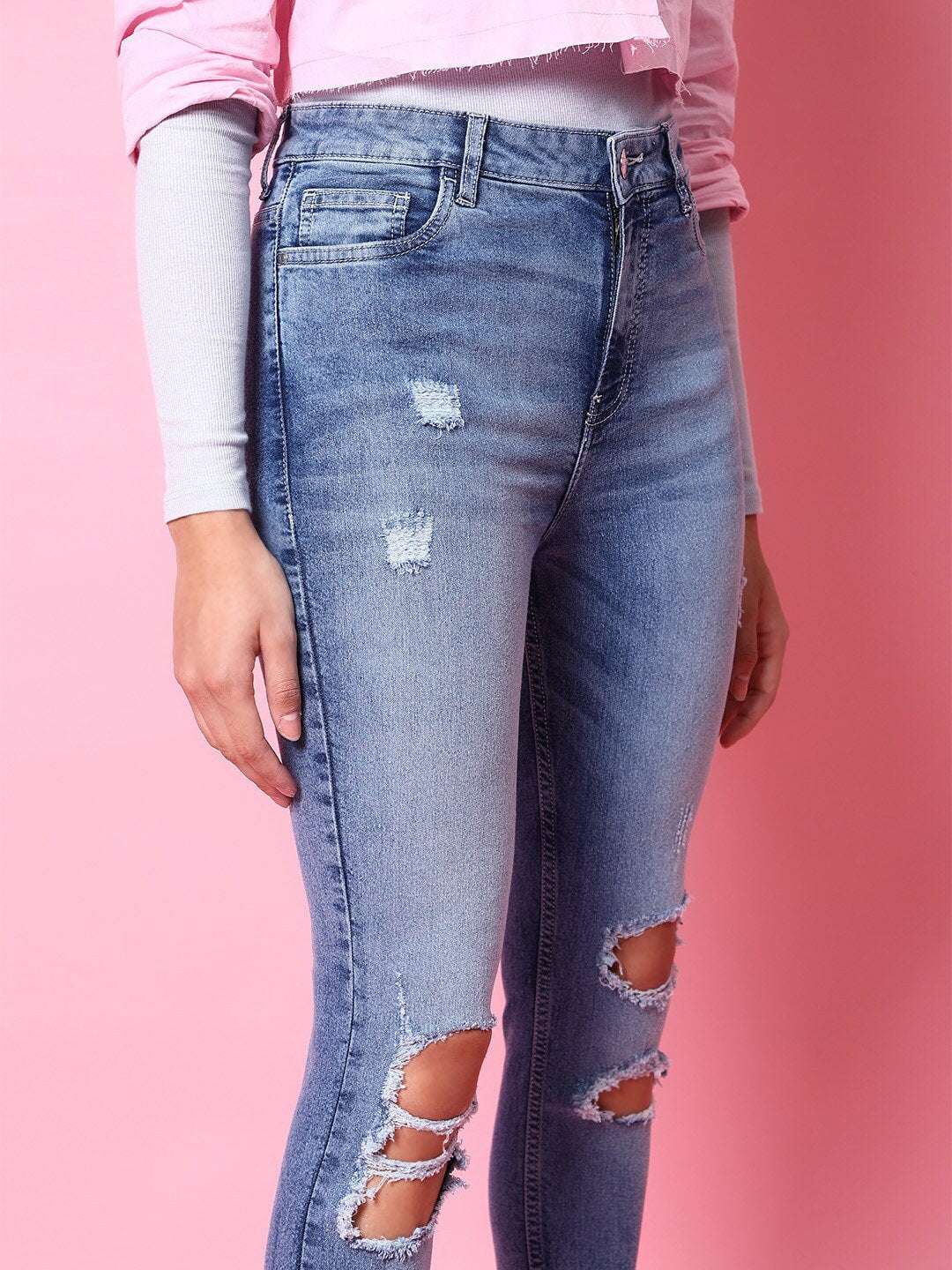 Shop Women Distressed Tinted Slim Fit Jeans Online.