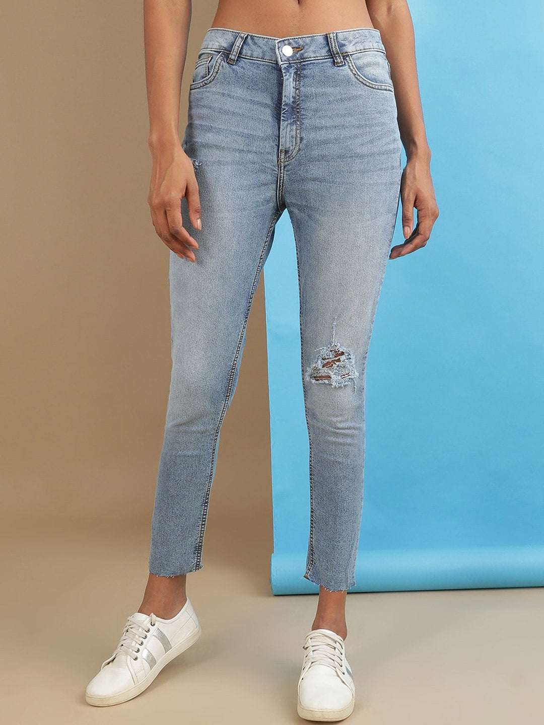 Shop Women Distressed Slim Fit Jeans Online.