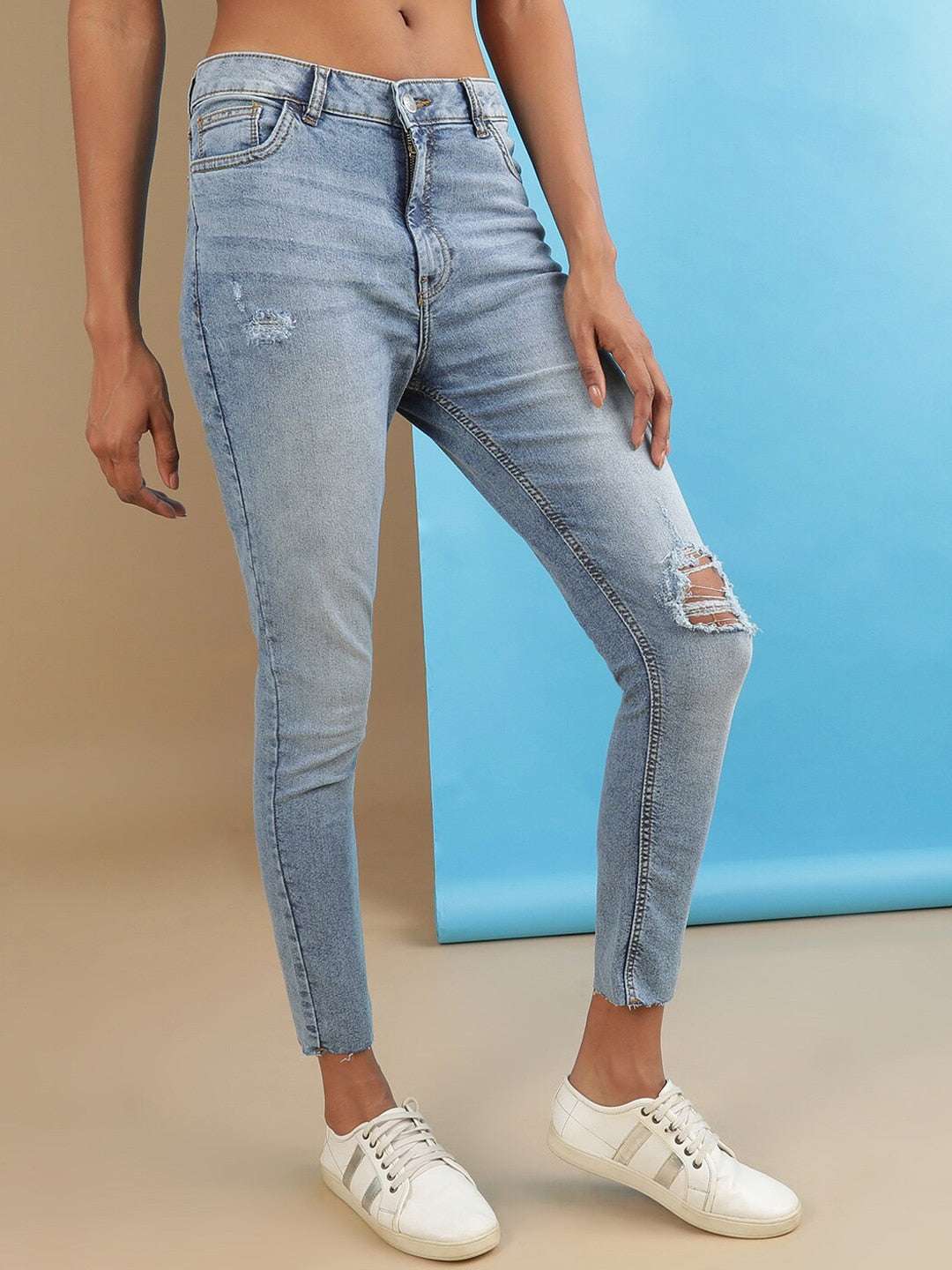 Shop Women Distressed Slim Fit Jeans Online.