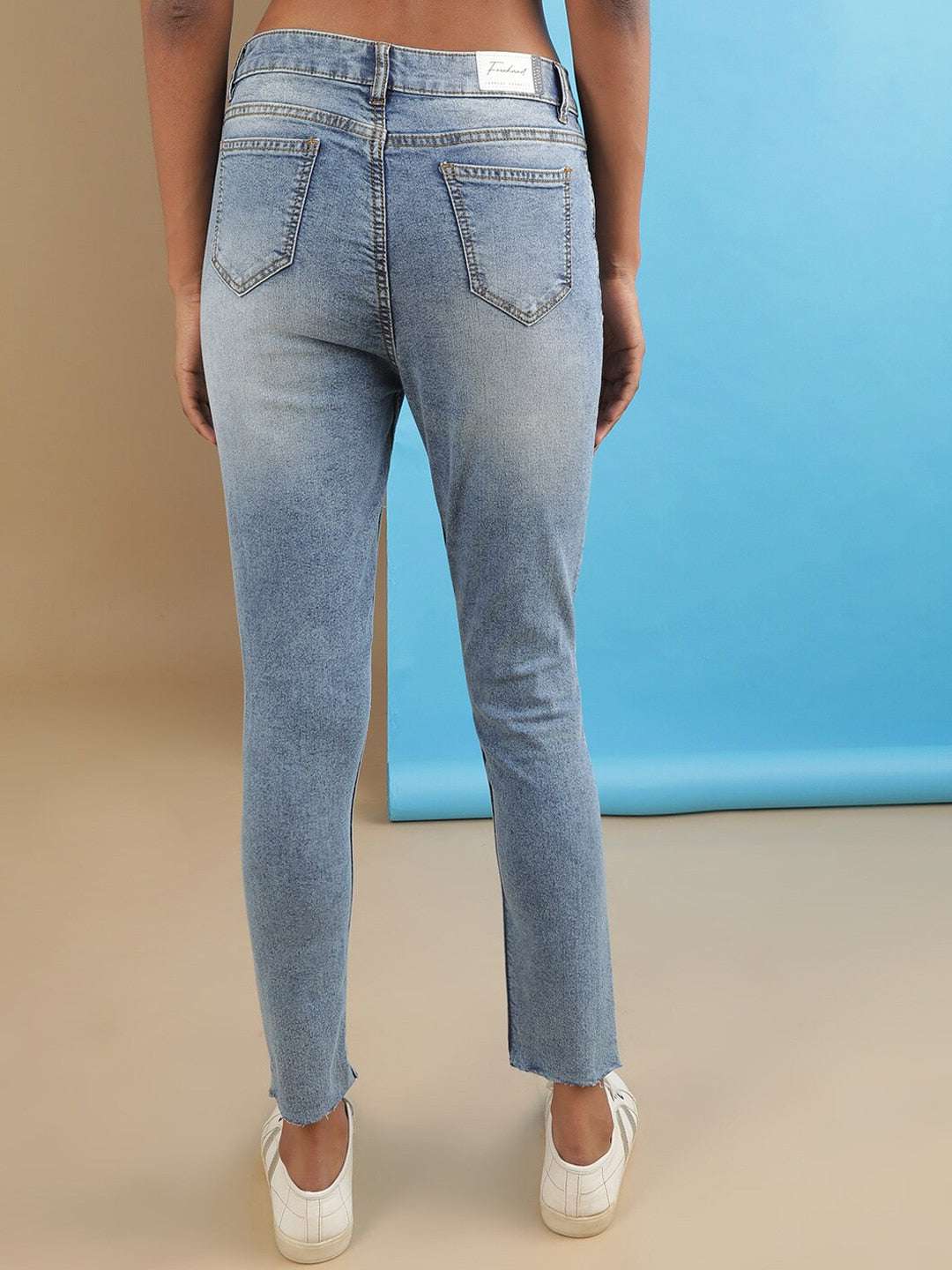 Shop Women Distressed Slim Fit Jeans Online.