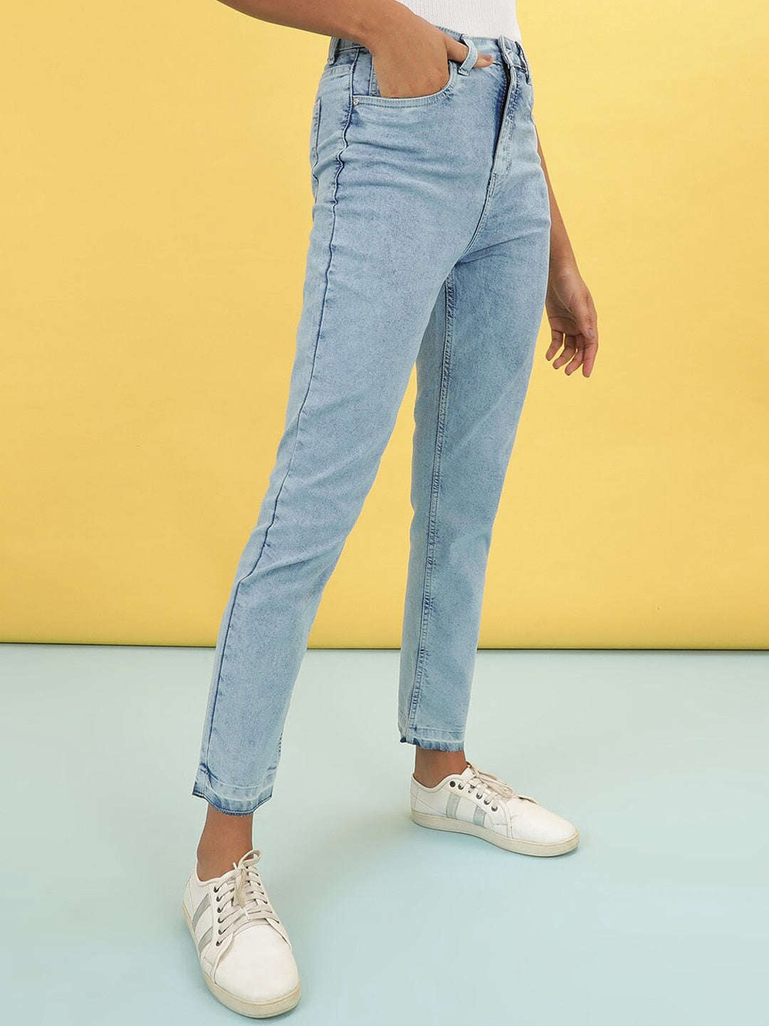 Shop Women Light Wash Straight Fit Denim Jeans Online.