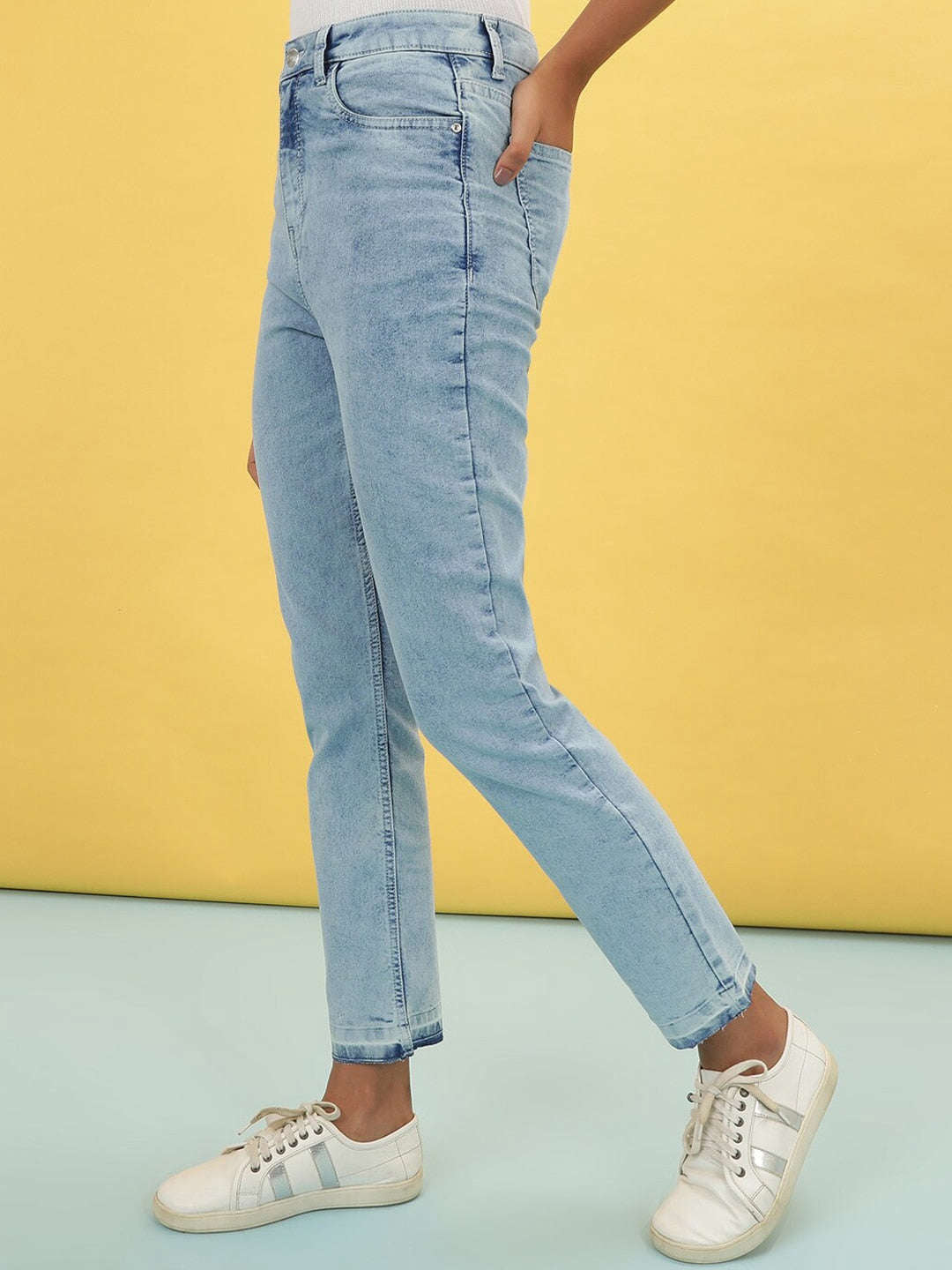 Shop Women Light Wash Straight Fit Denim Jeans Online.