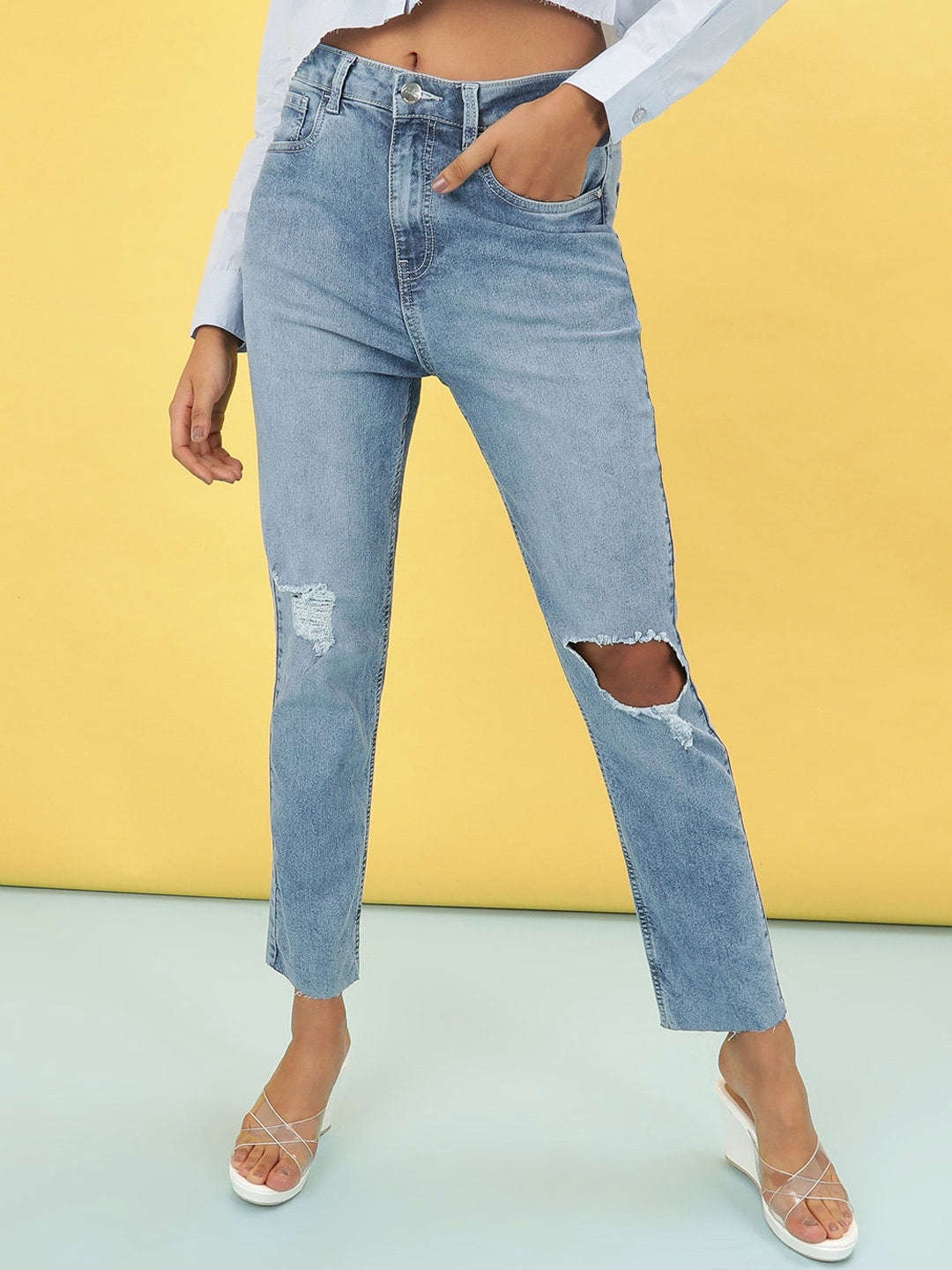 Shop Women Light Wash Straight Fit Denim Jeans Online.