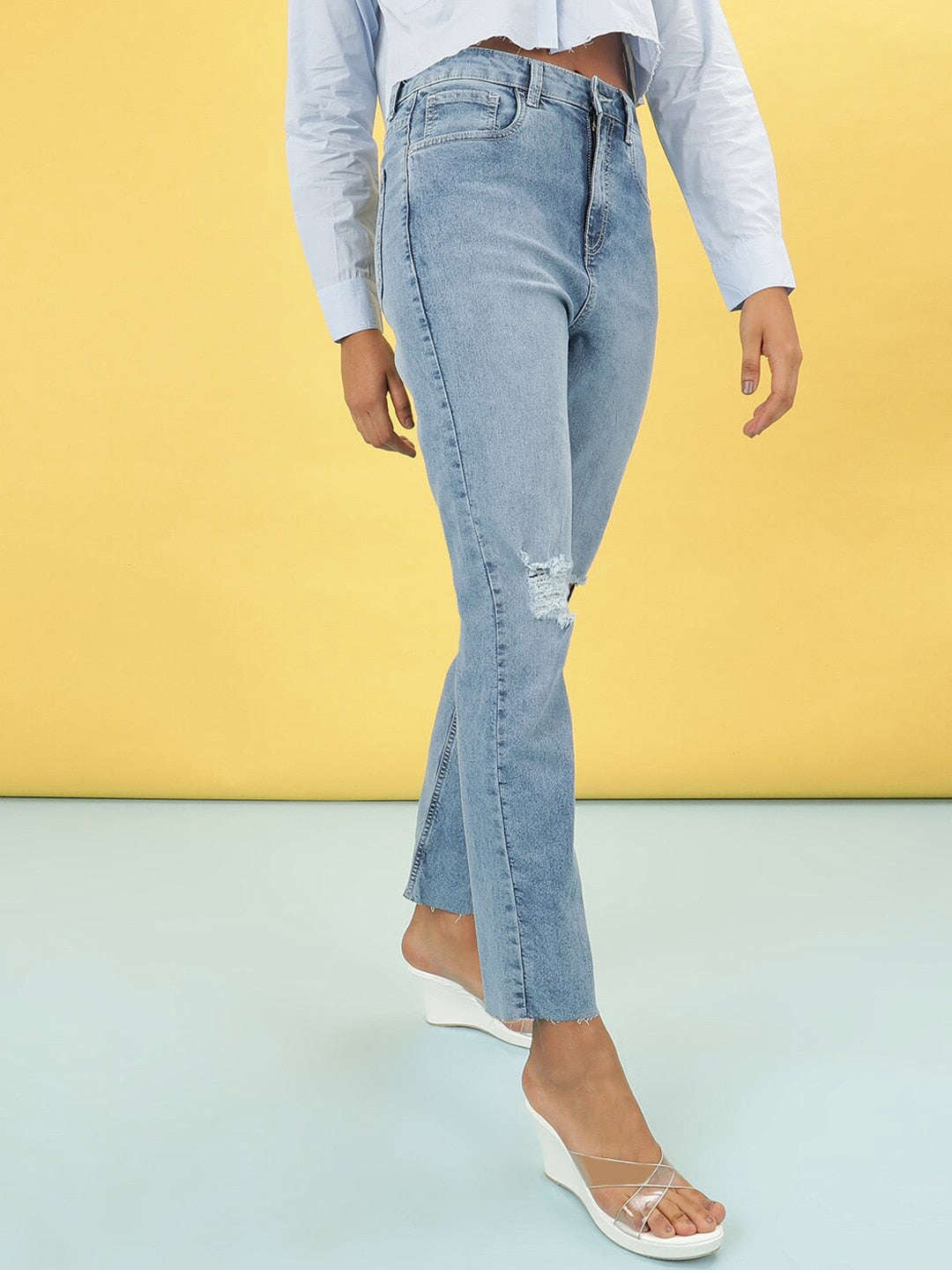 Shop Women Light Wash Straight Fit Denim Jeans Online.