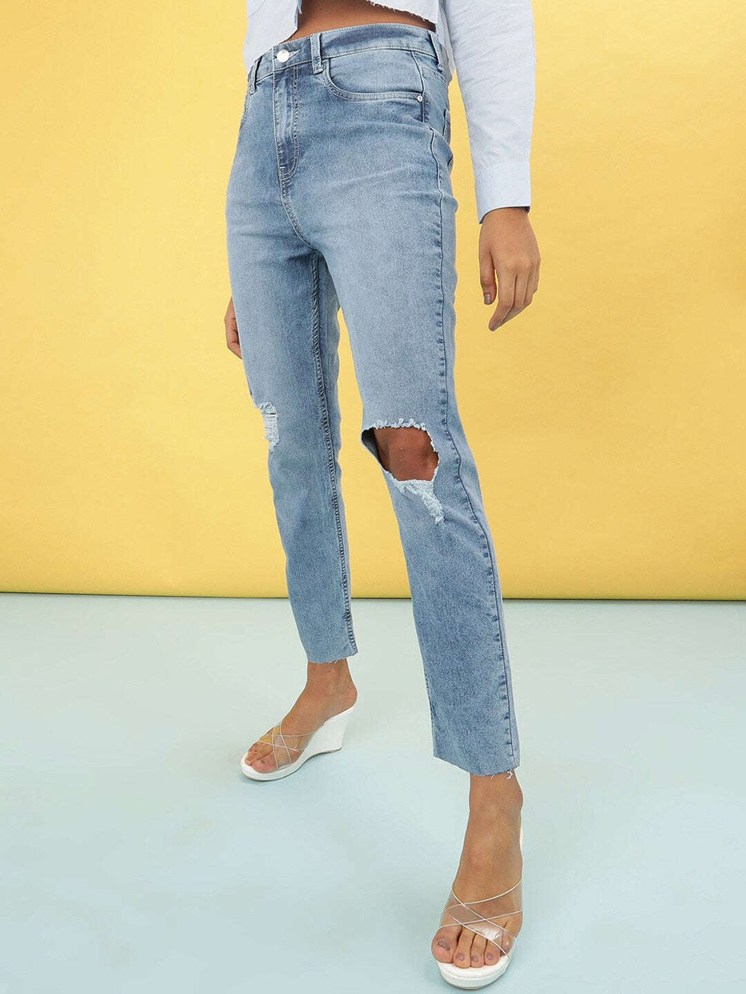 Shop Women Light Wash Straight Fit Denim Jeans Online.