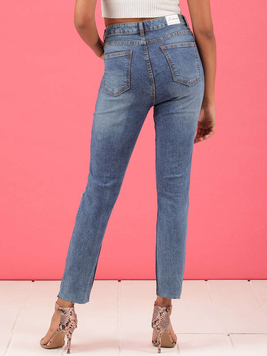 Shop Women Distressed Straight Fit Jeans Online.