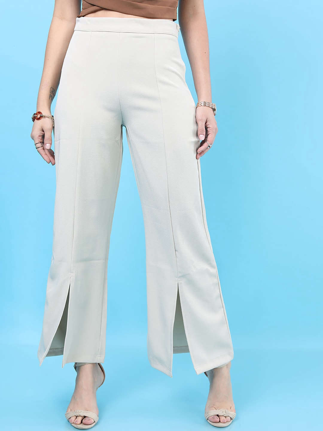 Shop Women Solid Flared Pants With Slit Online.