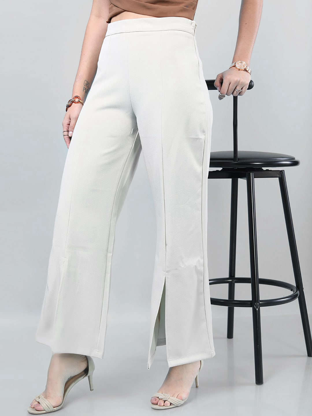 Shop Women Solid Flared Pants With Slit Online.