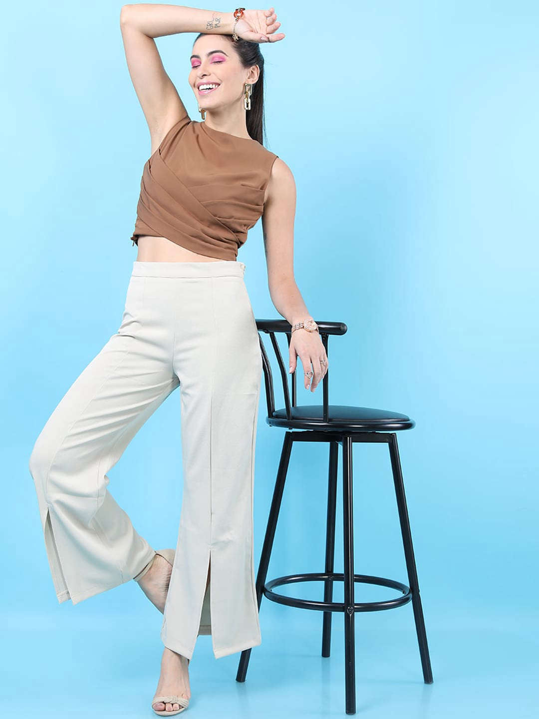 Shop Women Solid Flared Pants With Slit Online.