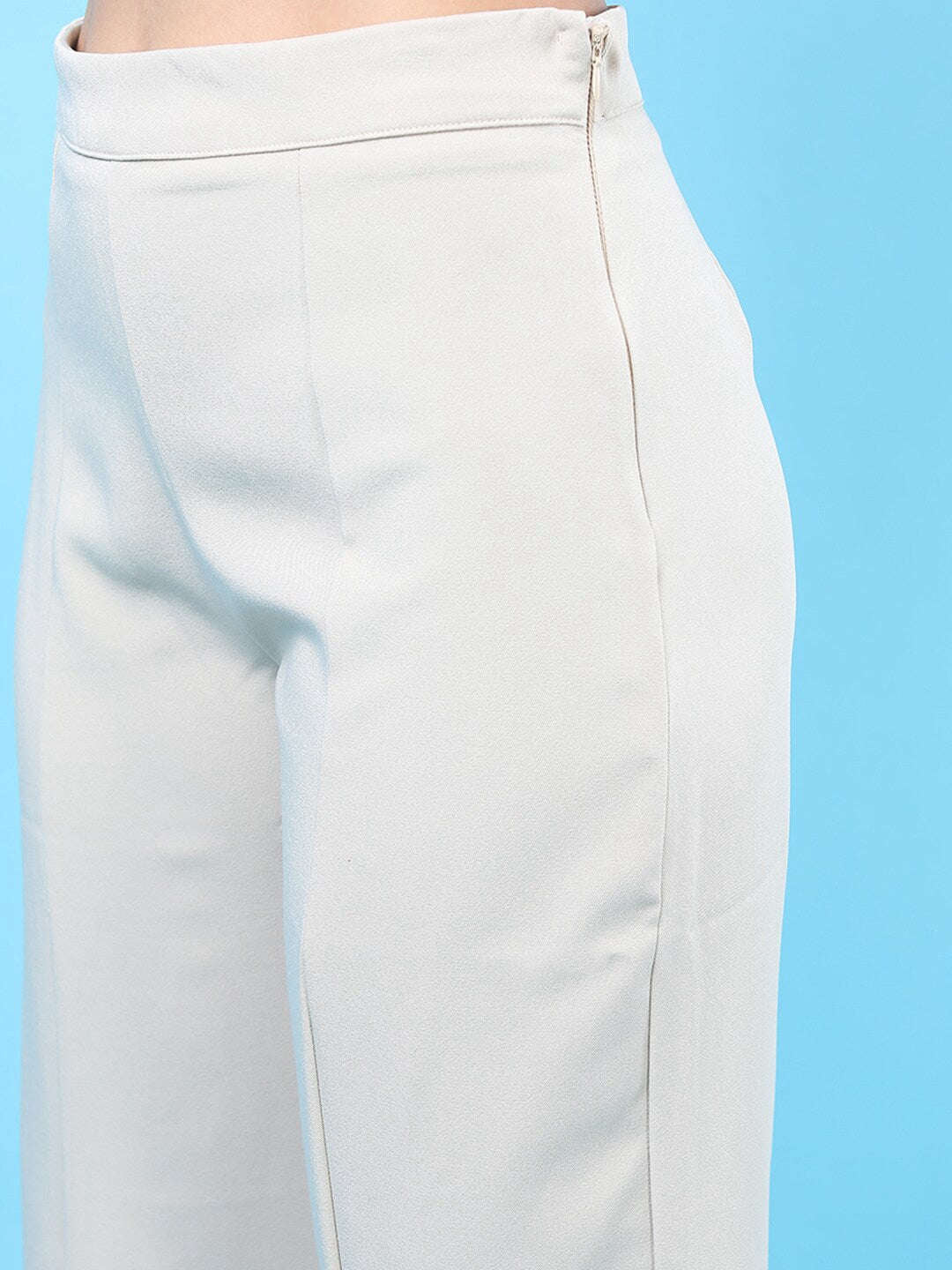 Shop Women Solid Flared Pants With Slit Online.