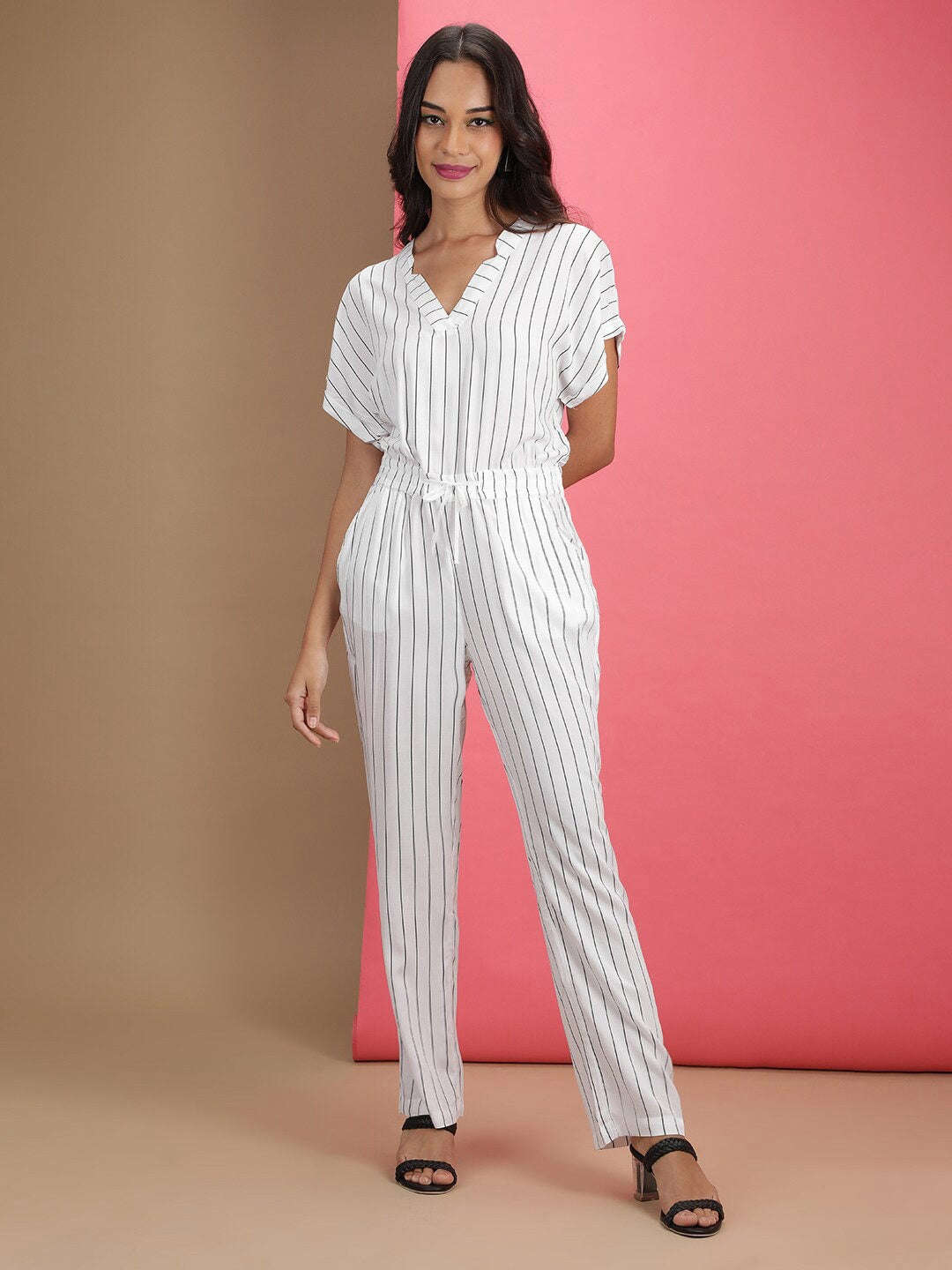 Shop Women Solid Jumpsuit With Scoop Pockets Online.