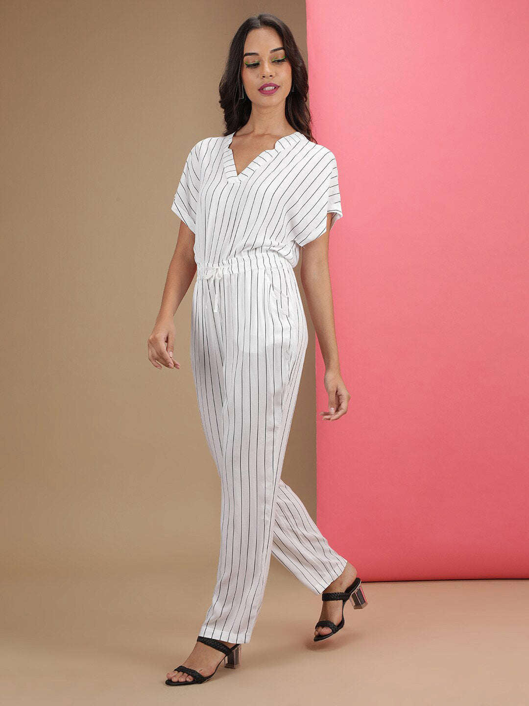 Shop Women Solid Jumpsuit With Scoop Pockets Online.