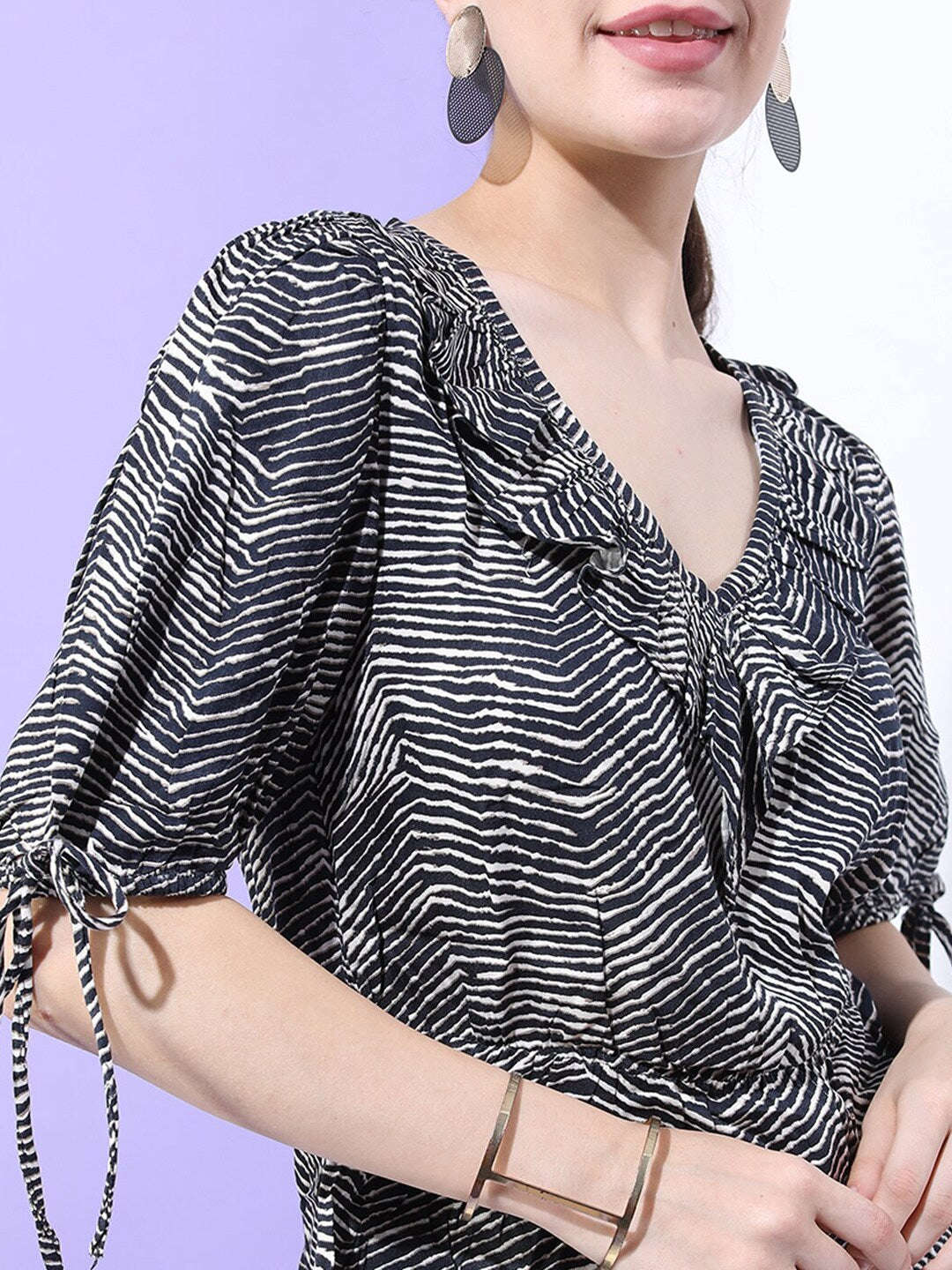 Shop Women Printed Top With Sleeve Tie Up Online.