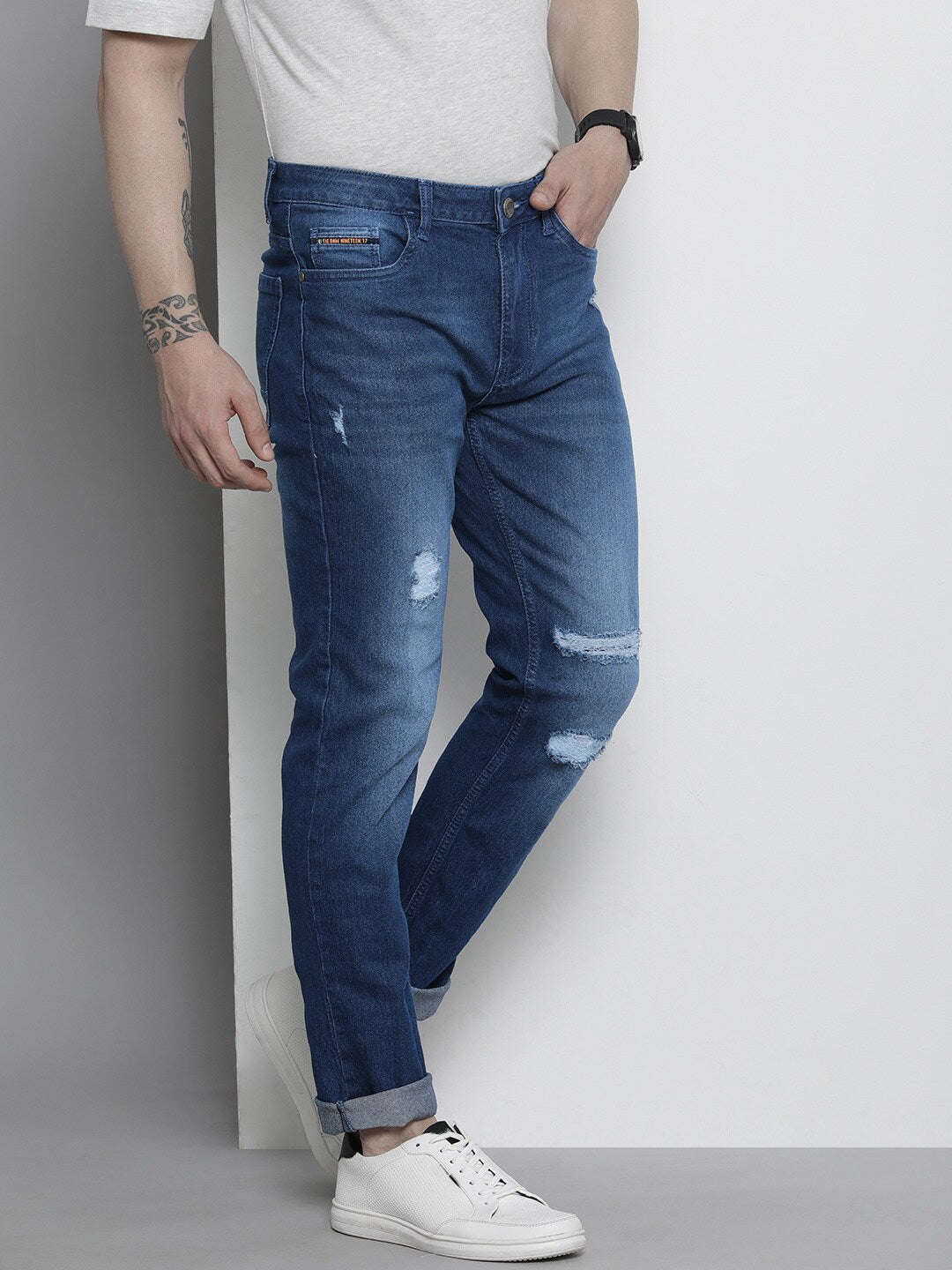 Shop Men Distressed Slim Jeans Online.