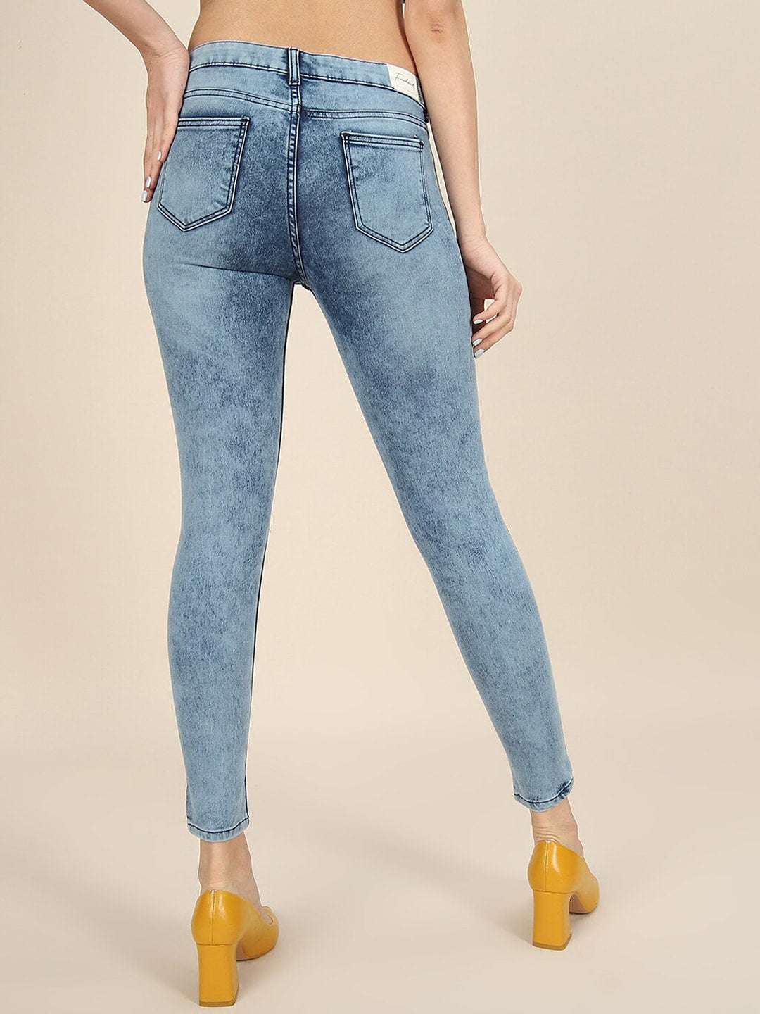 Shop Women Distressed Slim-Fit Jeans Online.