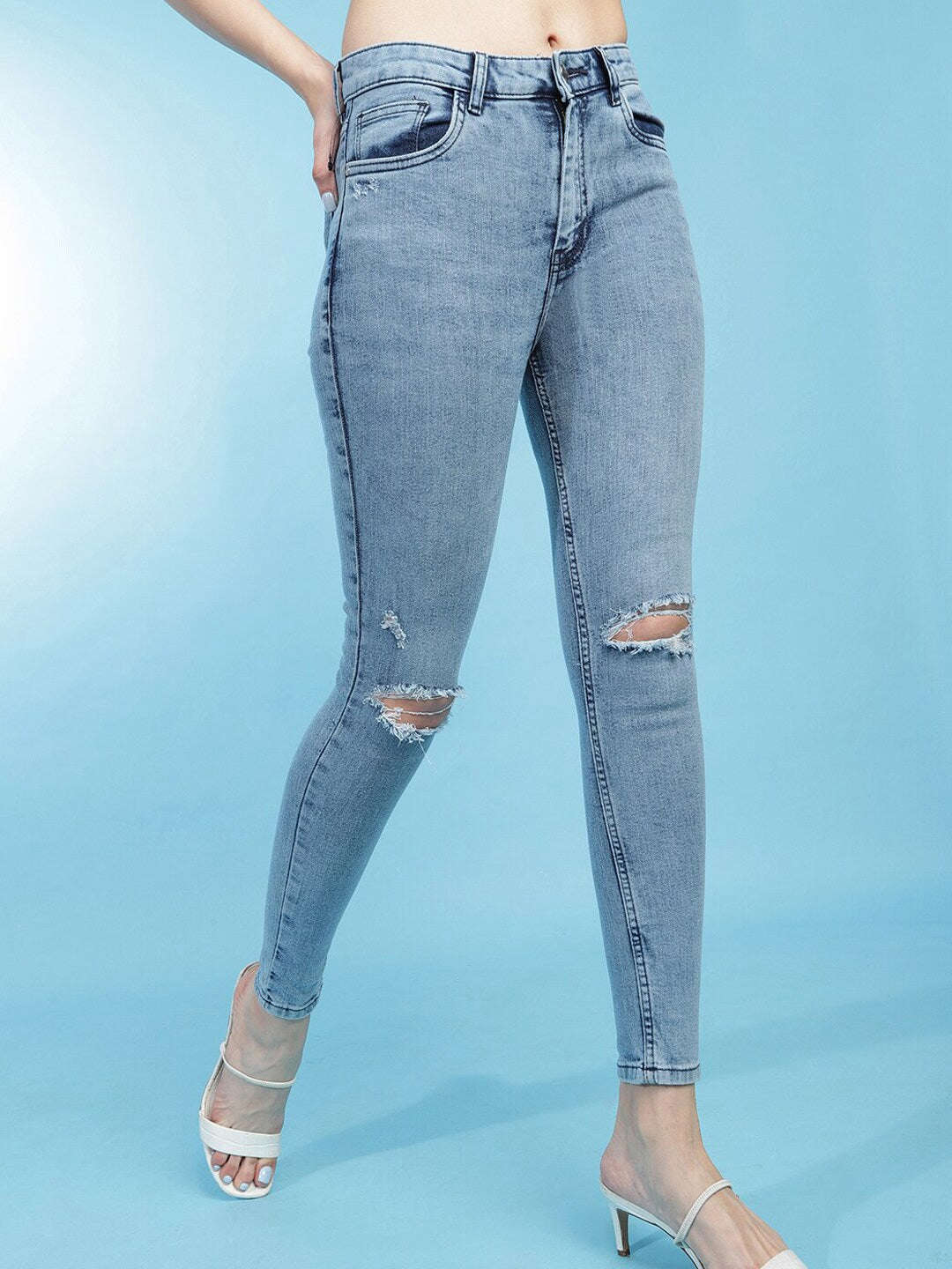 Shop Women Distressed Slim-Fit Jeans Online.