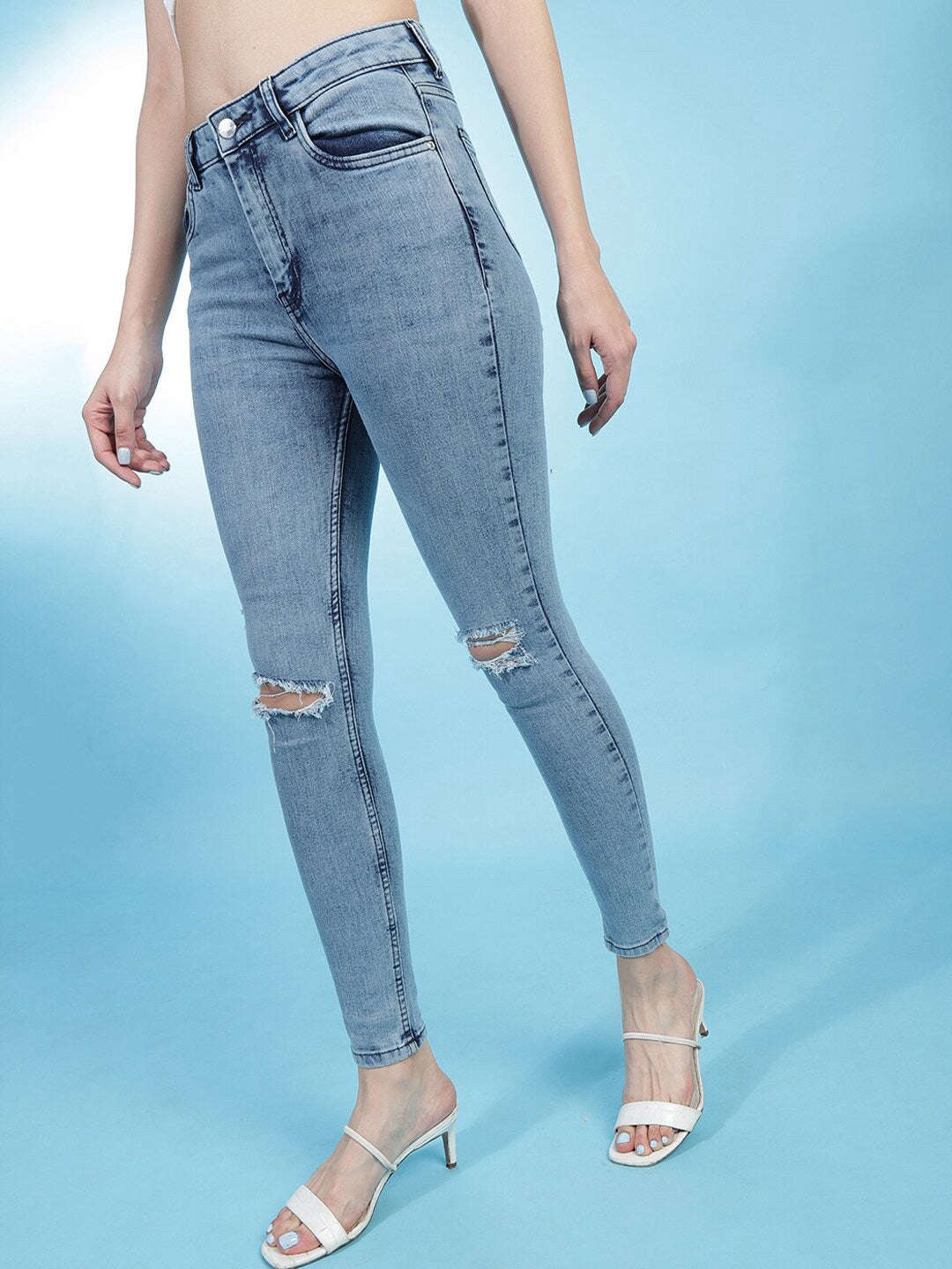 Shop Women Distressed Slim-Fit Jeans Online.