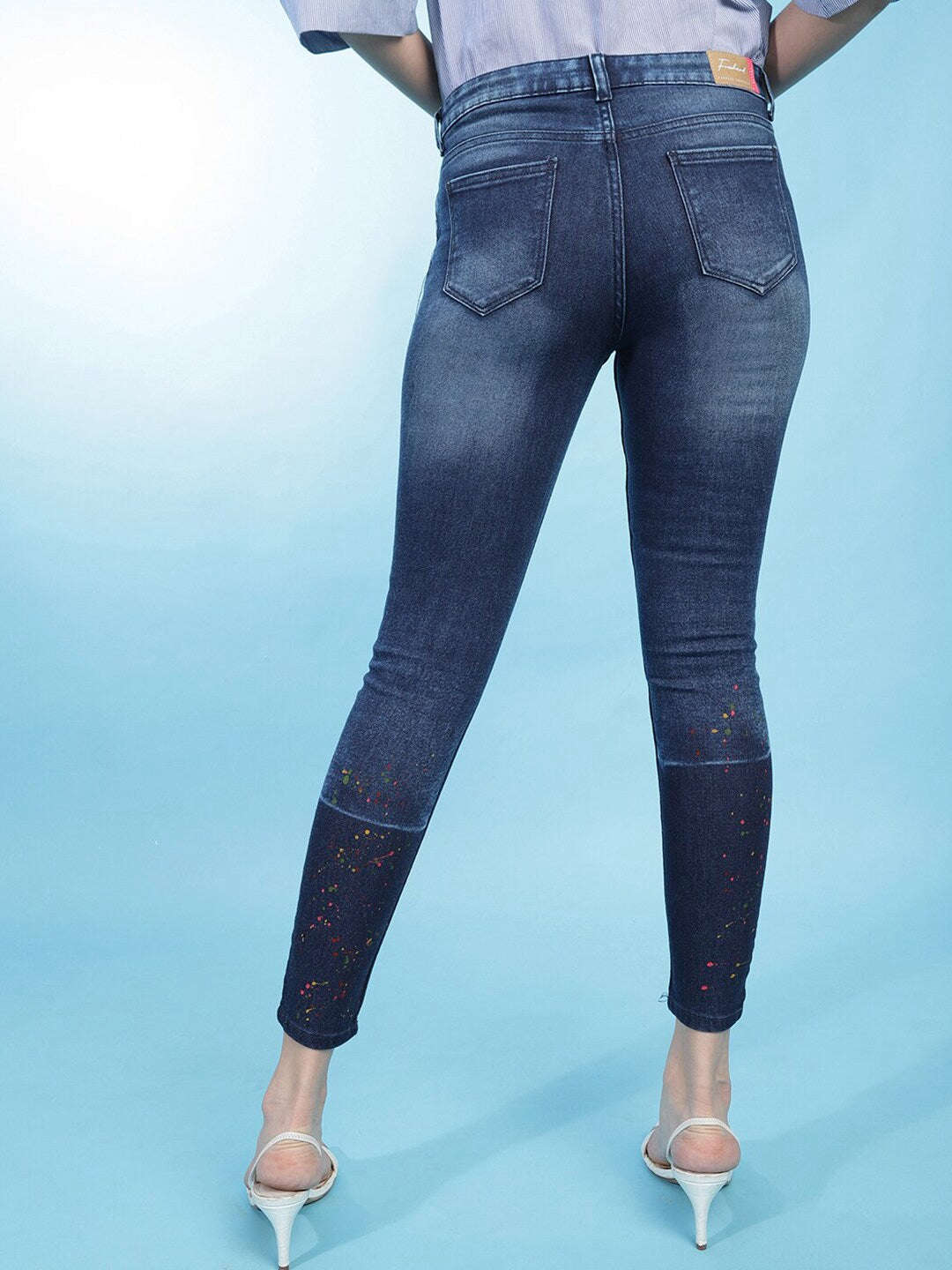 Shop Women Distressed Slim-Fit Jeans Online.