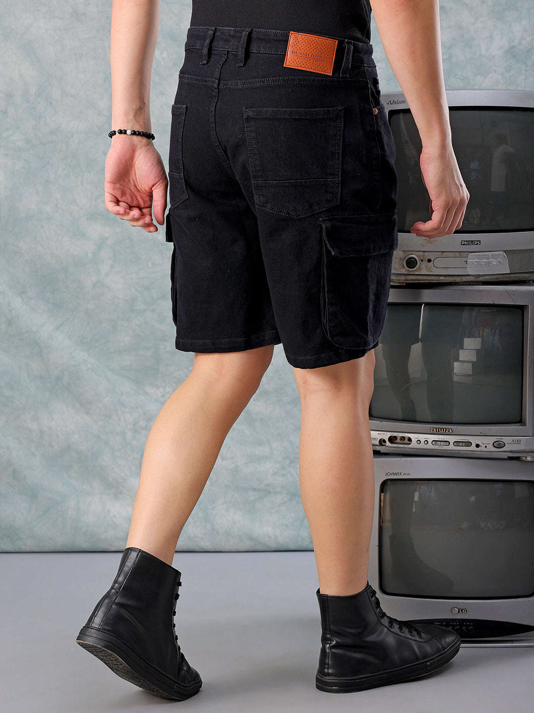 Shop Men Black Relaxed Fit Solid Denim Shorts Online.