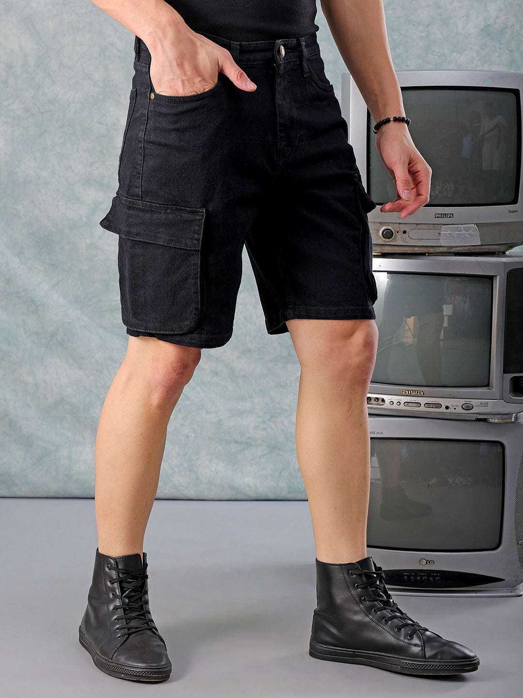 Shop Men Black Relaxed Fit Solid Denim Shorts Online.