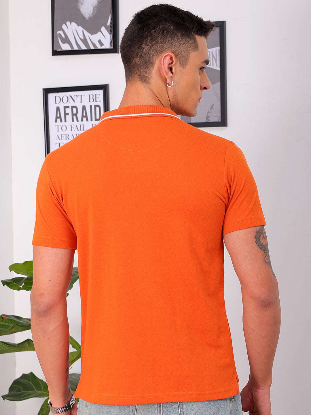 Shop Men's Orange Regular Fit Solid Polo T-Shirt Online.