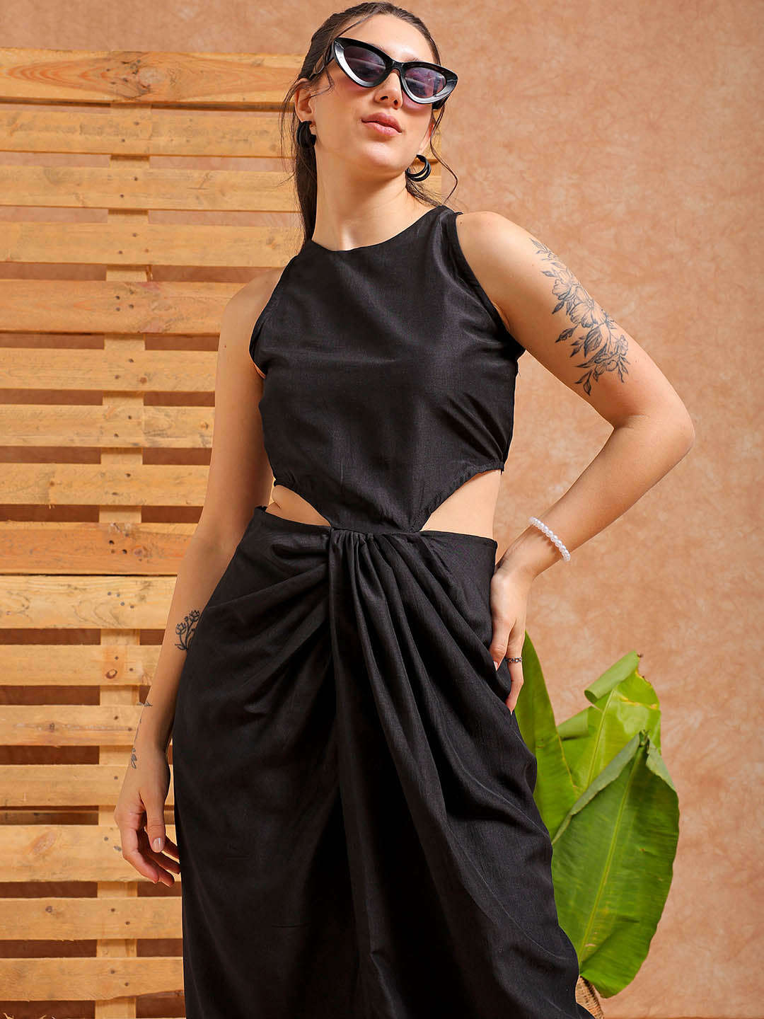 Shop Women's Black Fit and Flare Solid Partywear Cut Out Dress Online.