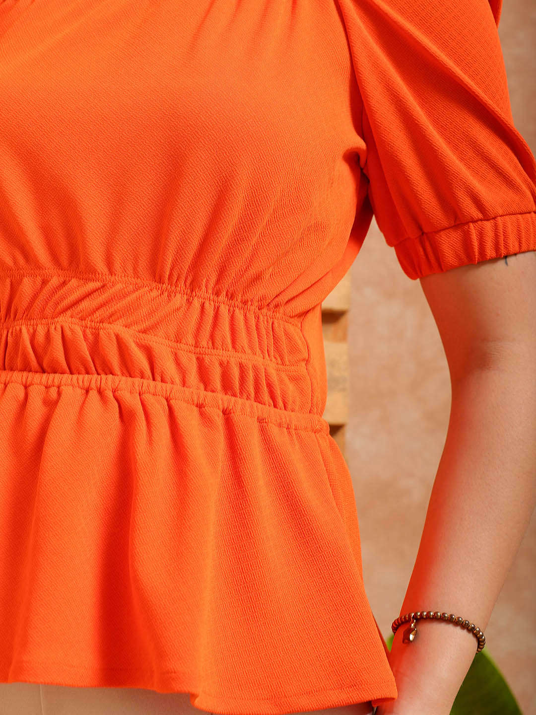 Shop Women's Orange Fit and Flare Textured Peplum Top Online.