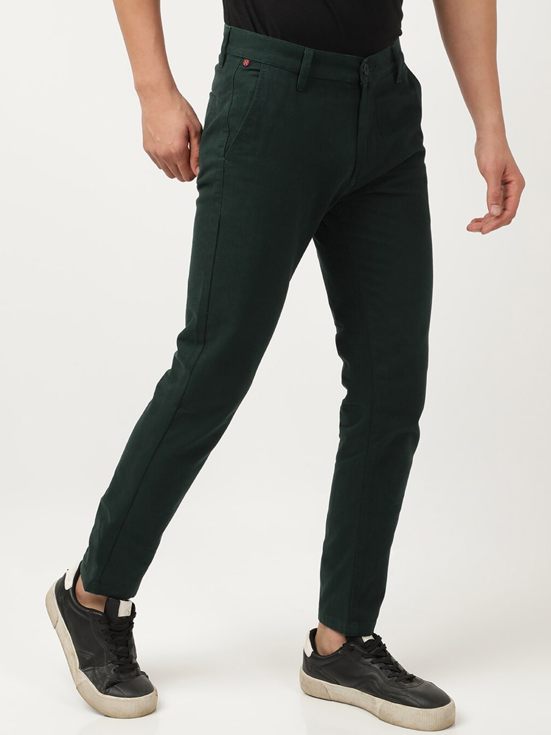 Shop Men Solid Mid-Rise Chinos Online.